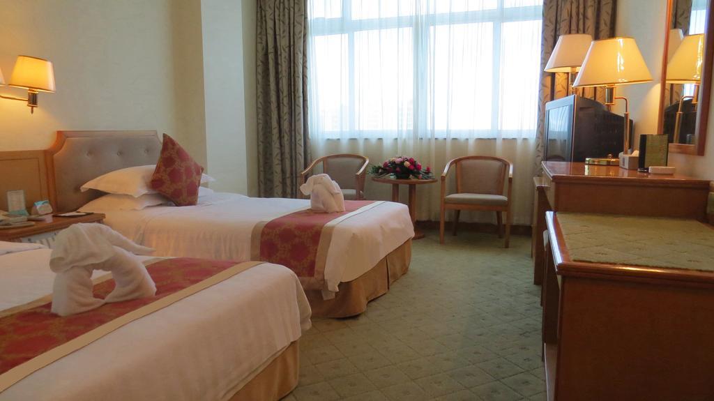 Hotel Guoxi San-ja Pokoj fotografie